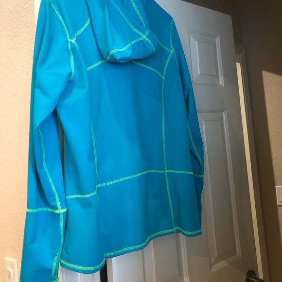 Kirkland Blue long Sleeve Front Zip Top with Hood. 85% Polyester, 15% Spandex. - Picture 2 of 6
